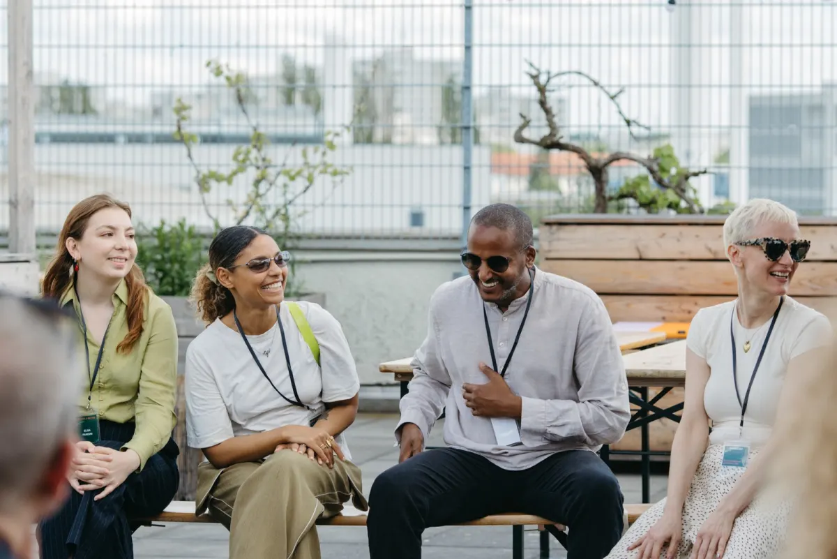 Therapists laughing and talking together on the terrace