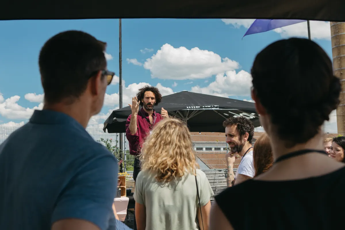 A speaker leading a conversation on the rooftop