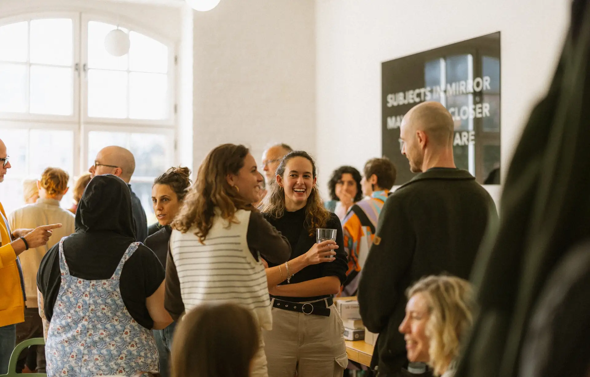 Therapists in conversation at a community gathering