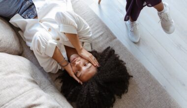 A Problematic Woman Lying on the Couch with Her Hands on Her Face