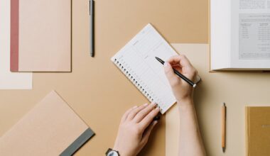 Top View of Woman Writing in a Planner