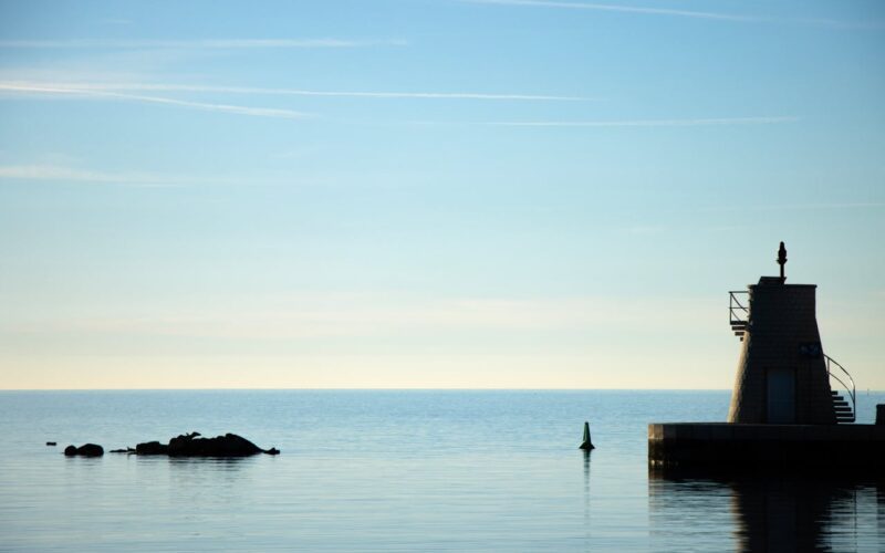 Silhouette of a Lighthouse Against the Adriatic Sea