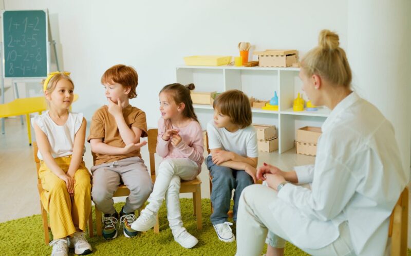 Kids Sitting on Chairs in a Classroom