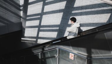 Man on Escalator with Geometric Shadows