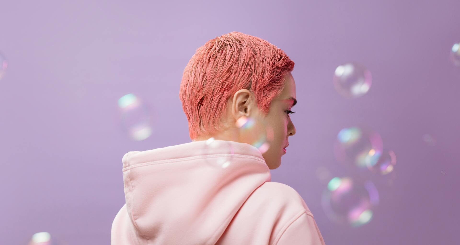 Back View of a Woman in a Pink Hoodie