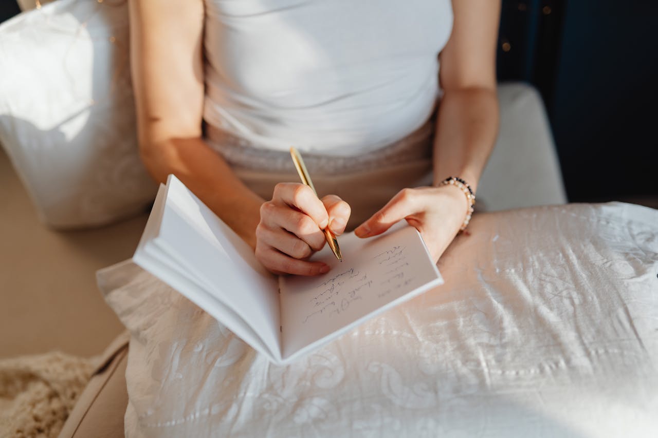Woman Writing in a Dream Diary Notebook