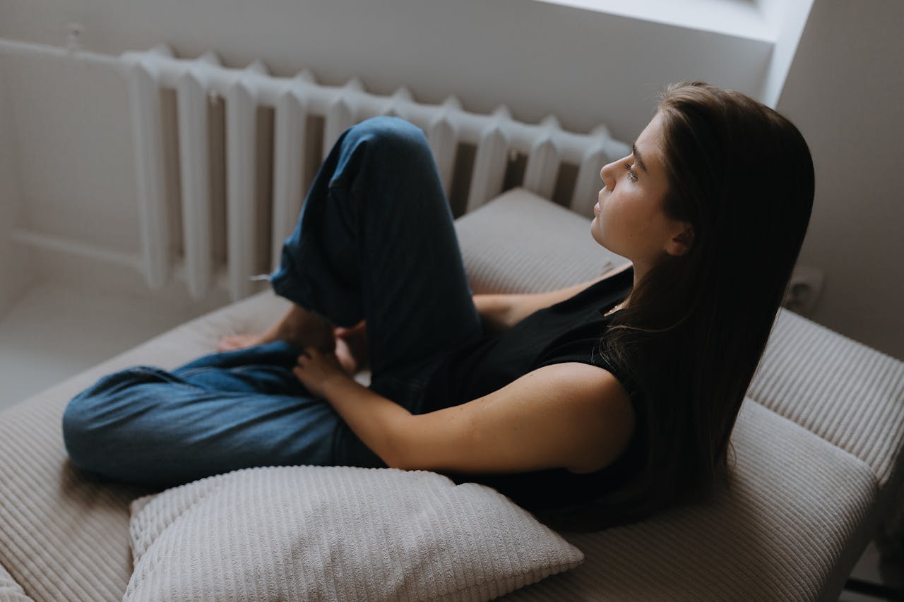 Woman Sitting alone on a Sofa