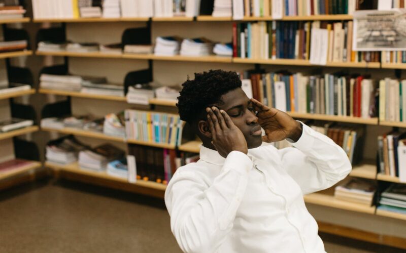 A Man Thinking with His Hands on Head