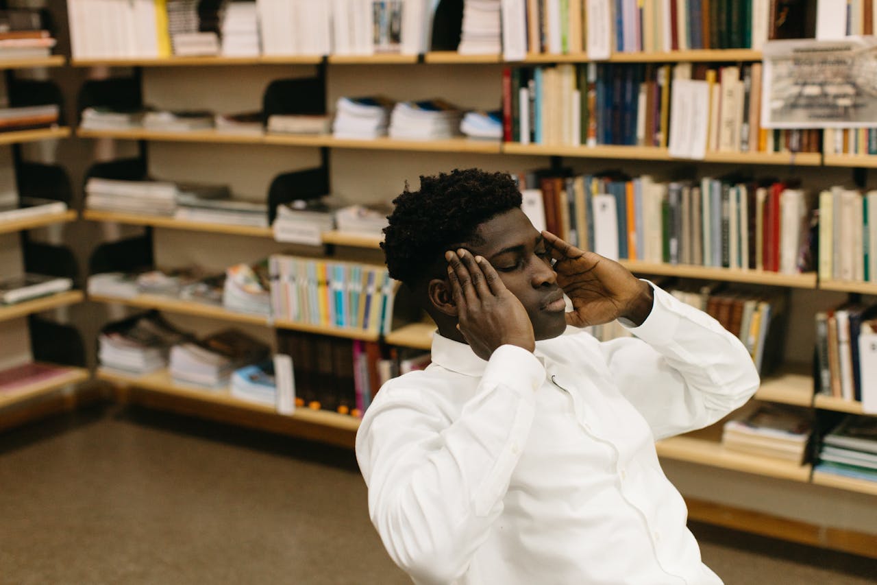 A Man Thinking with His Hands on Head