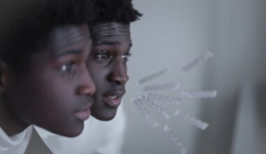Man Standing Close to Mirror While Speaking