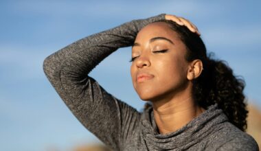 Woman practicing calm self-regulation, eyes closed in a moment of stillness