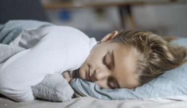 A Young Girl in White Long Sleeve Shirt Sleeping