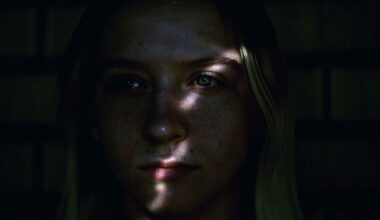A young adult in shadows captures a moment of introspection and contemplation